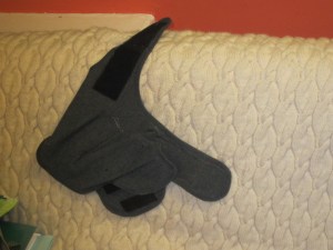 The couch finds that Thunder Shirt very comforting.